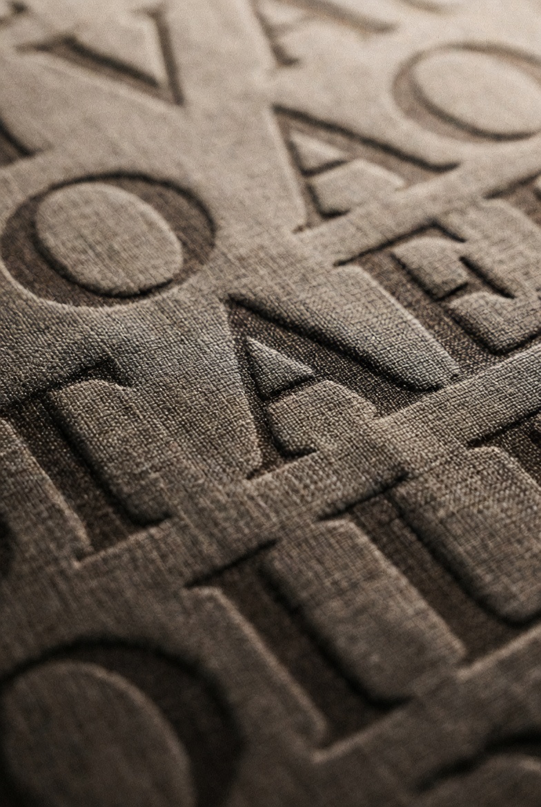 Vải thun chữ nổi là gì ?